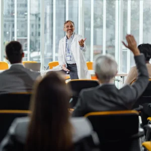 A speaker engaging an audience during a business presentation.