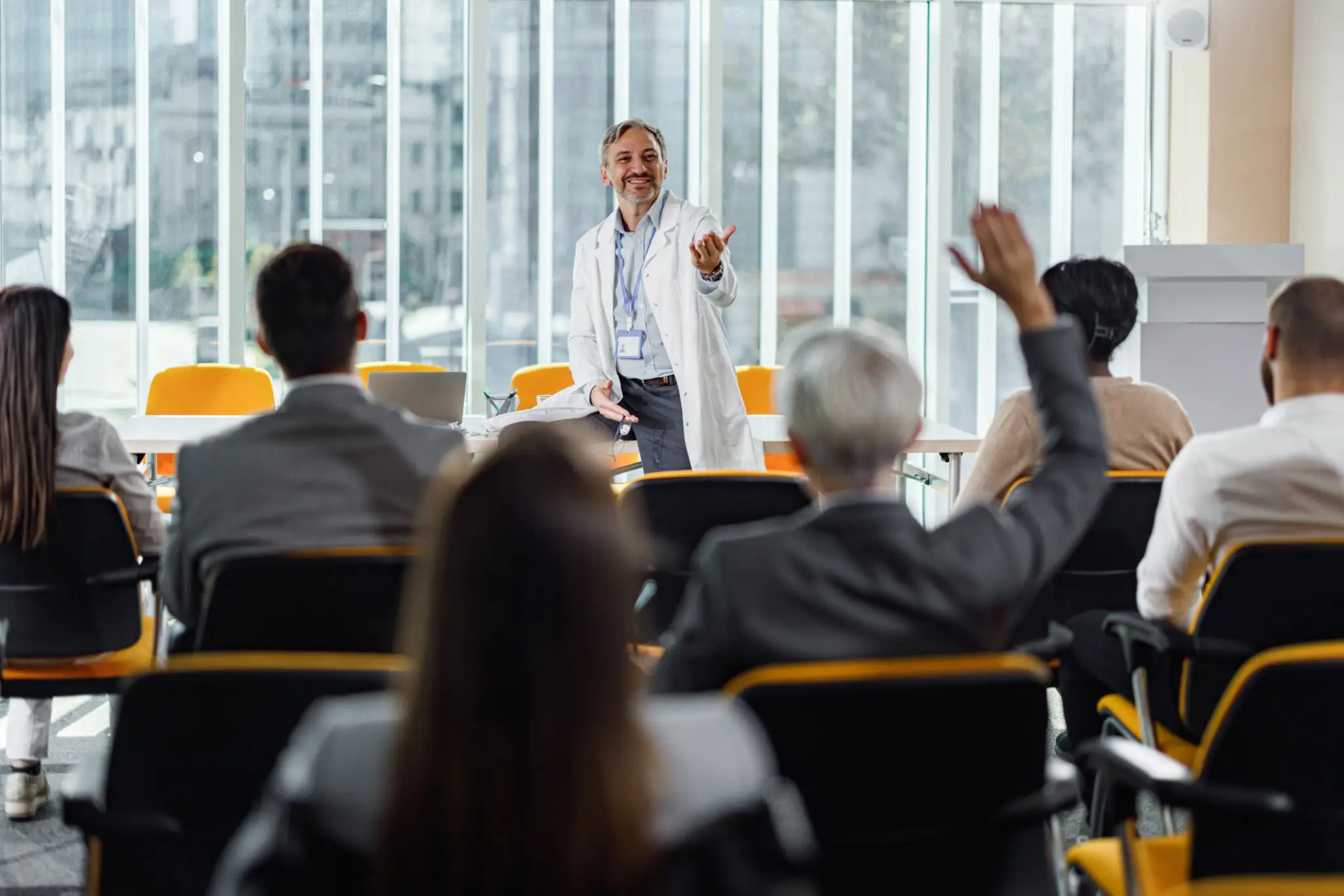A speaker engaging an audience during a business presentation.